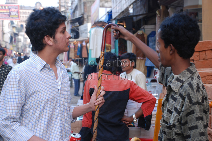 DSC 0169 
 Man shopping in Lad Bazar, Hyderabad, India 
 Keywords: hyderabad, india, indian street, shopping, market