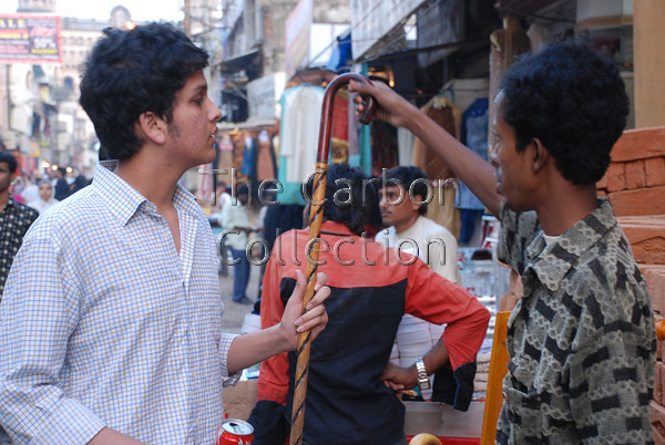 DSC 0169 
 Man shopping in Lad Bazar street market, Hyderabad, India. 
 Keywords: street trader market india shopping