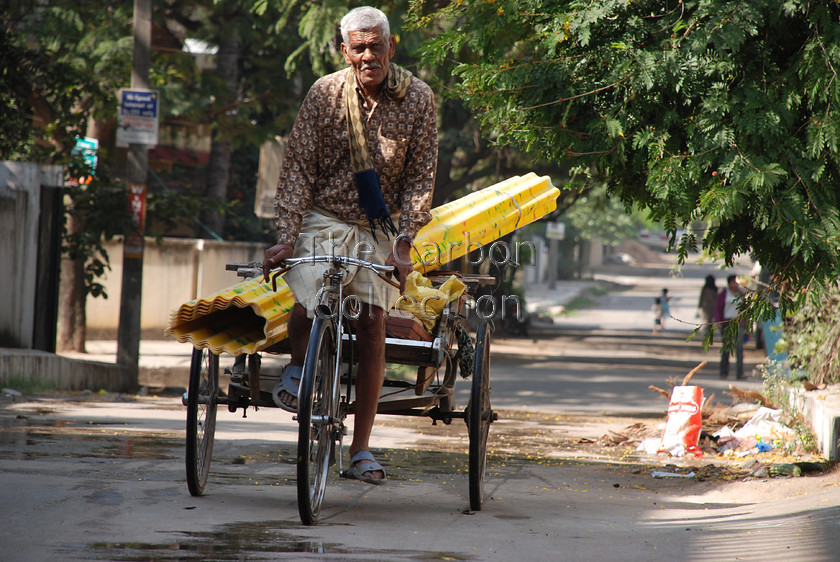 DSC 0246 
 Street trader in Hyderabad, India. 
 Keywords: india street trader