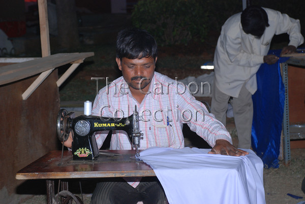 DSC 0031 
 Made-to-order items at Annual Exhibition (Numaish) in Hyderabad, India. 
 Keywords: india tailor sewing machine