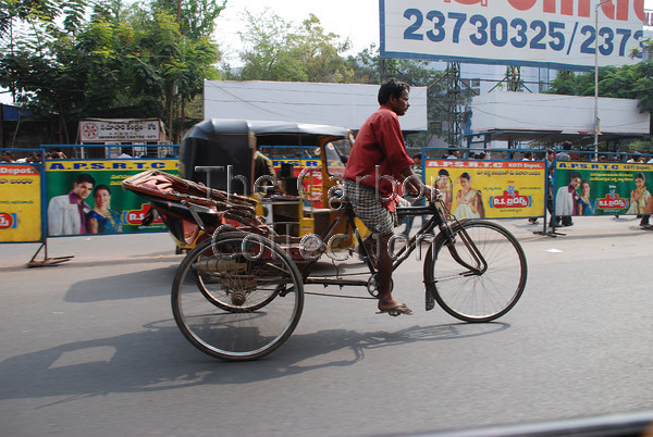 DSC 0212 
 Cycle Rickshaw and Auto Rickshaw side-by-side in Hyderabad, India. 
 Keywords: rickshaw india